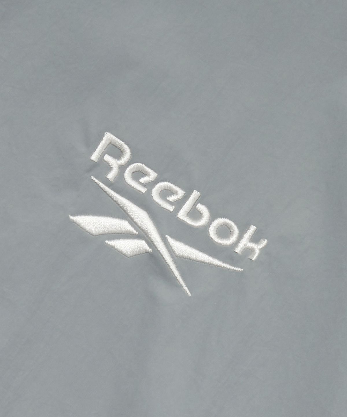 리복(REEBOK) 일립스 반팔 아노락 - 그레이