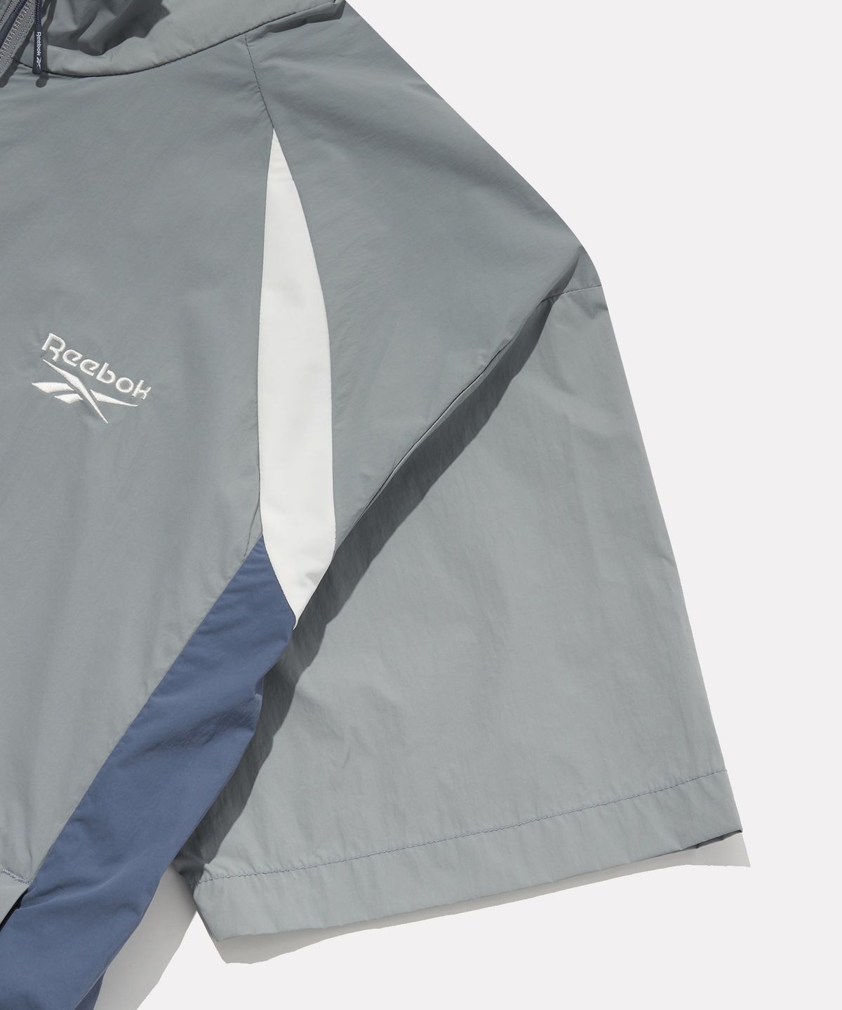 리복(REEBOK) 일립스 반팔 아노락 - 그레이