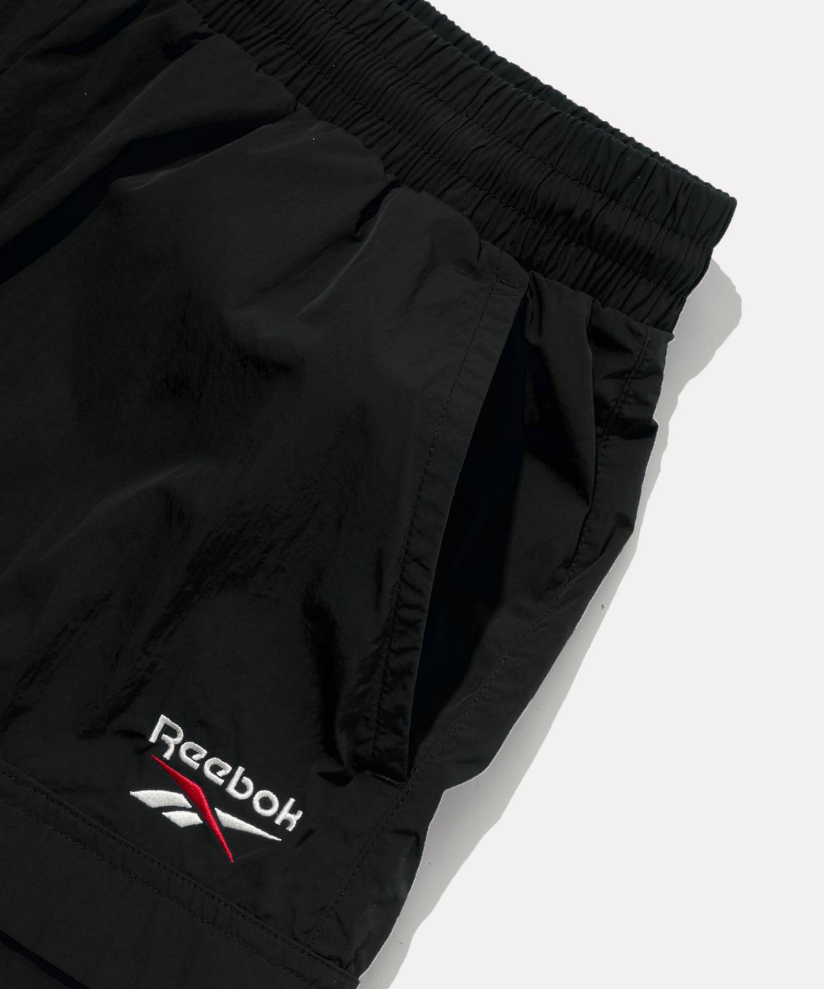 리복(REEBOK) 일립스 포켓 쇼츠 - 블랙