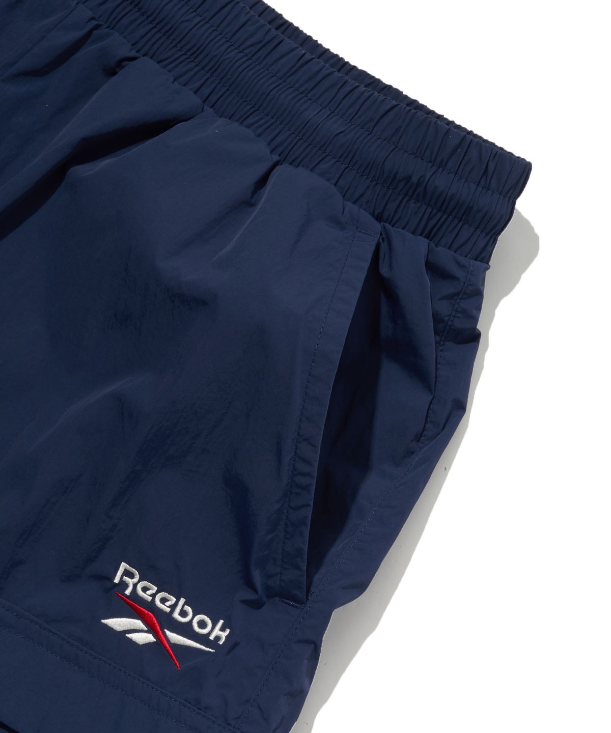 리복(REEBOK) 일립스 포켓 쇼츠 - 네이비