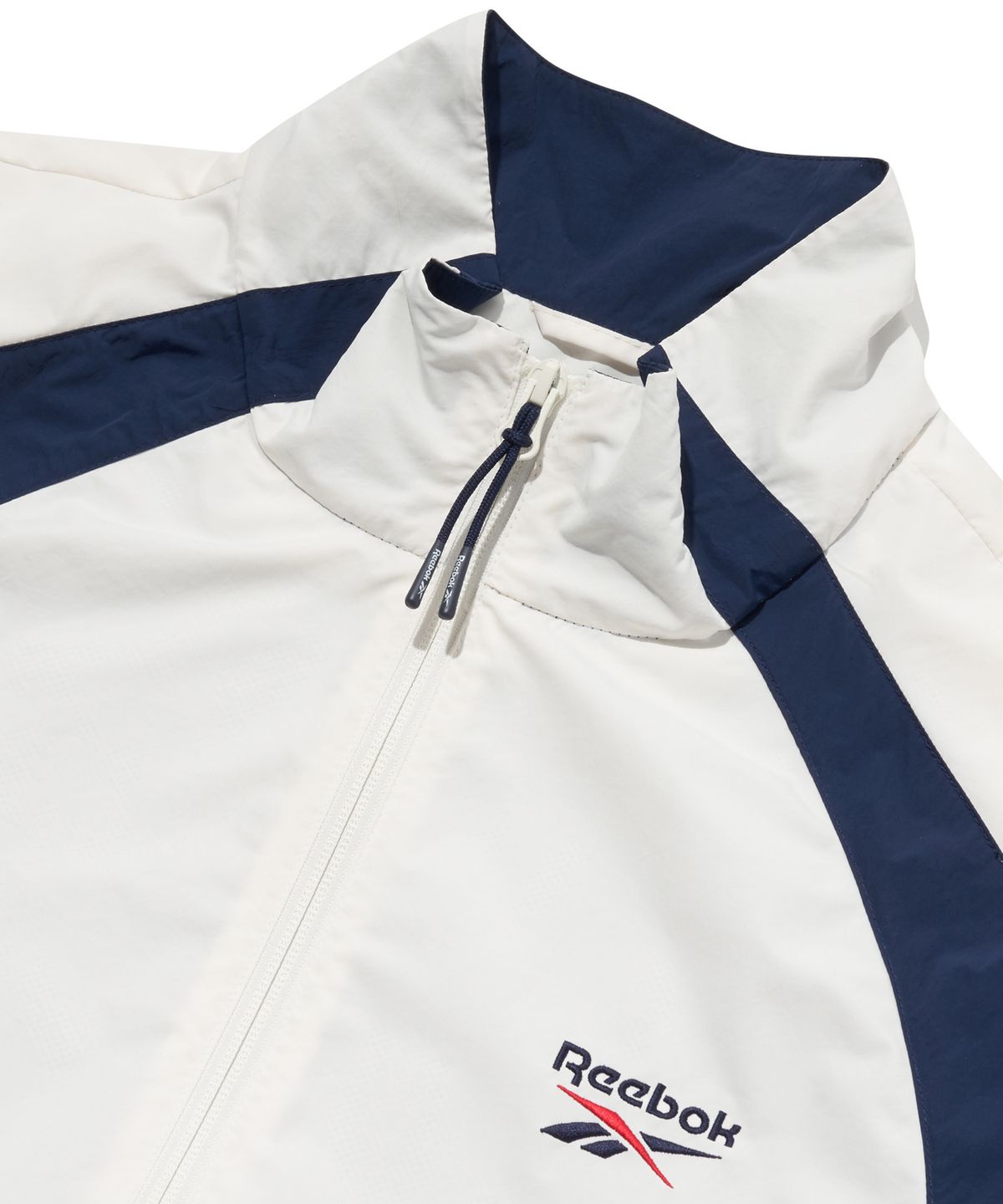 리복(REEBOK) 일립스 윈드 브레이커 - 화이트:네이비