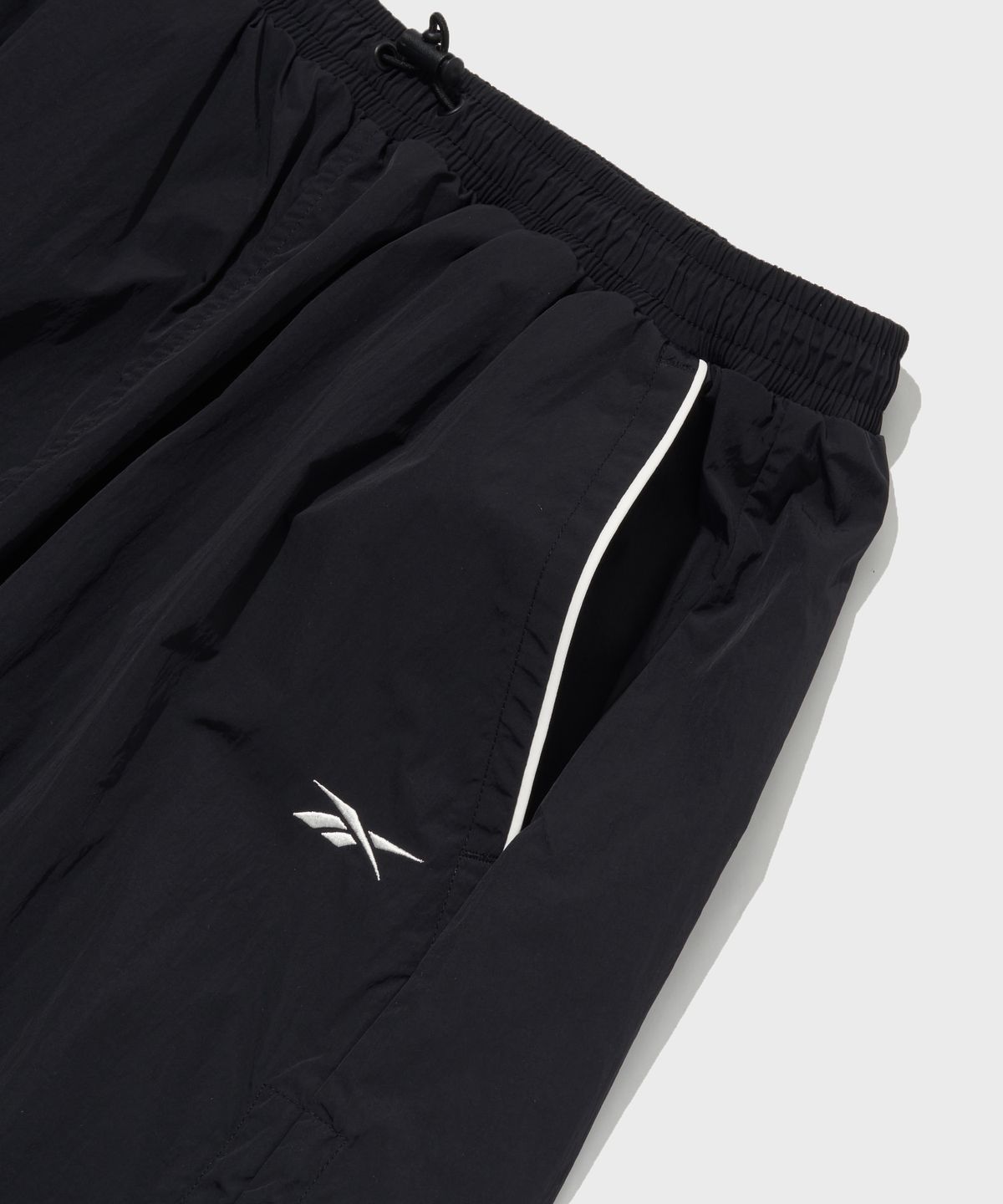 리복(REEBOK) 일립스 파라슈트 스커트 (W) - 블랙