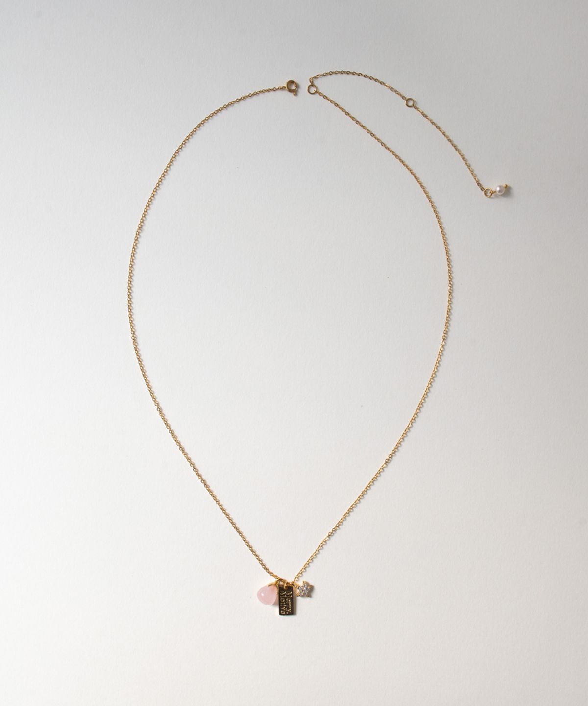 메리모티브(MERRYMOTIVE) Rose gemstone and star pendant necklace