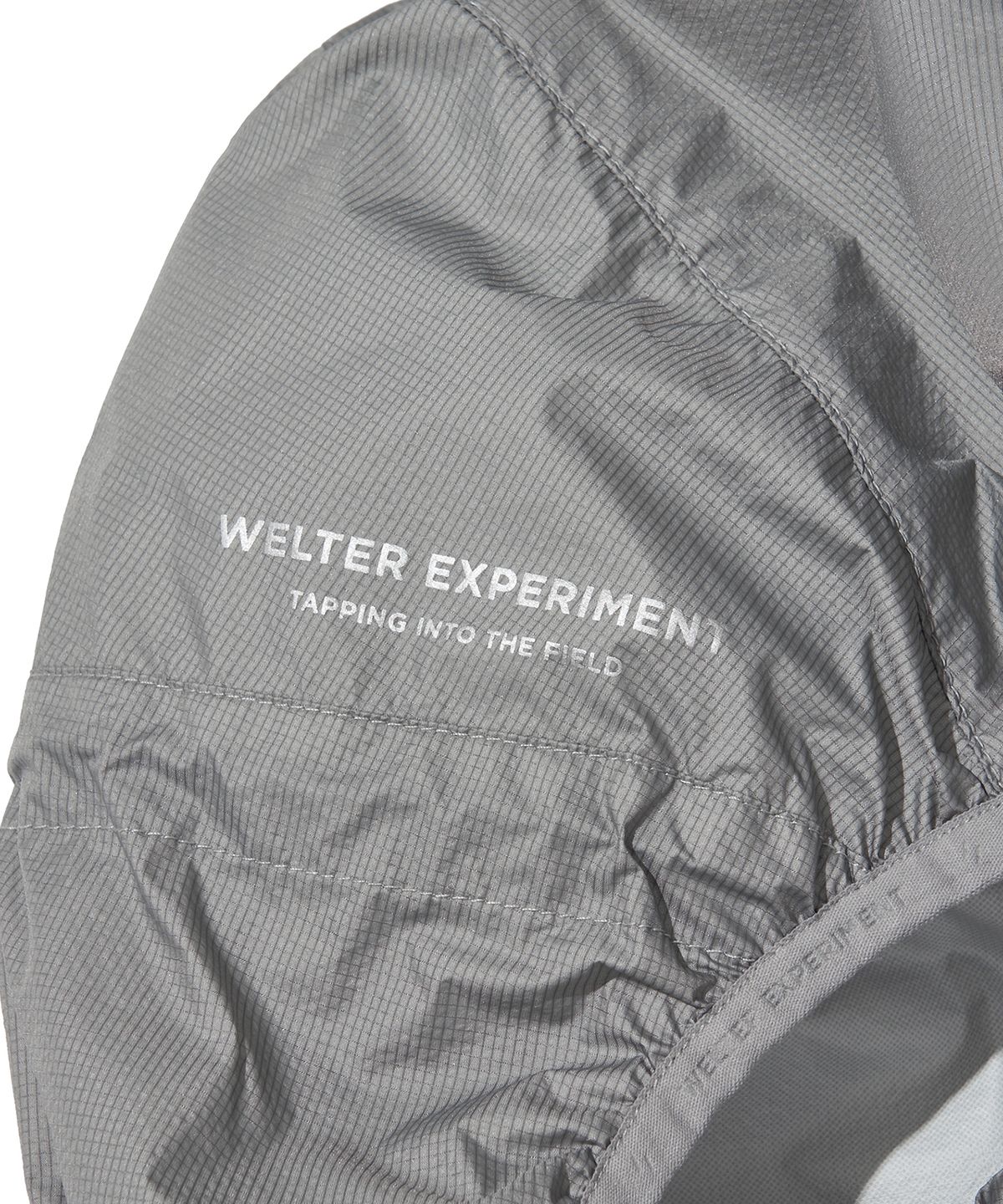 웰터 익스페리먼트(WELTER EXPERIMENT) ANEMOI LIGHT WINDBREAKER_GRAY