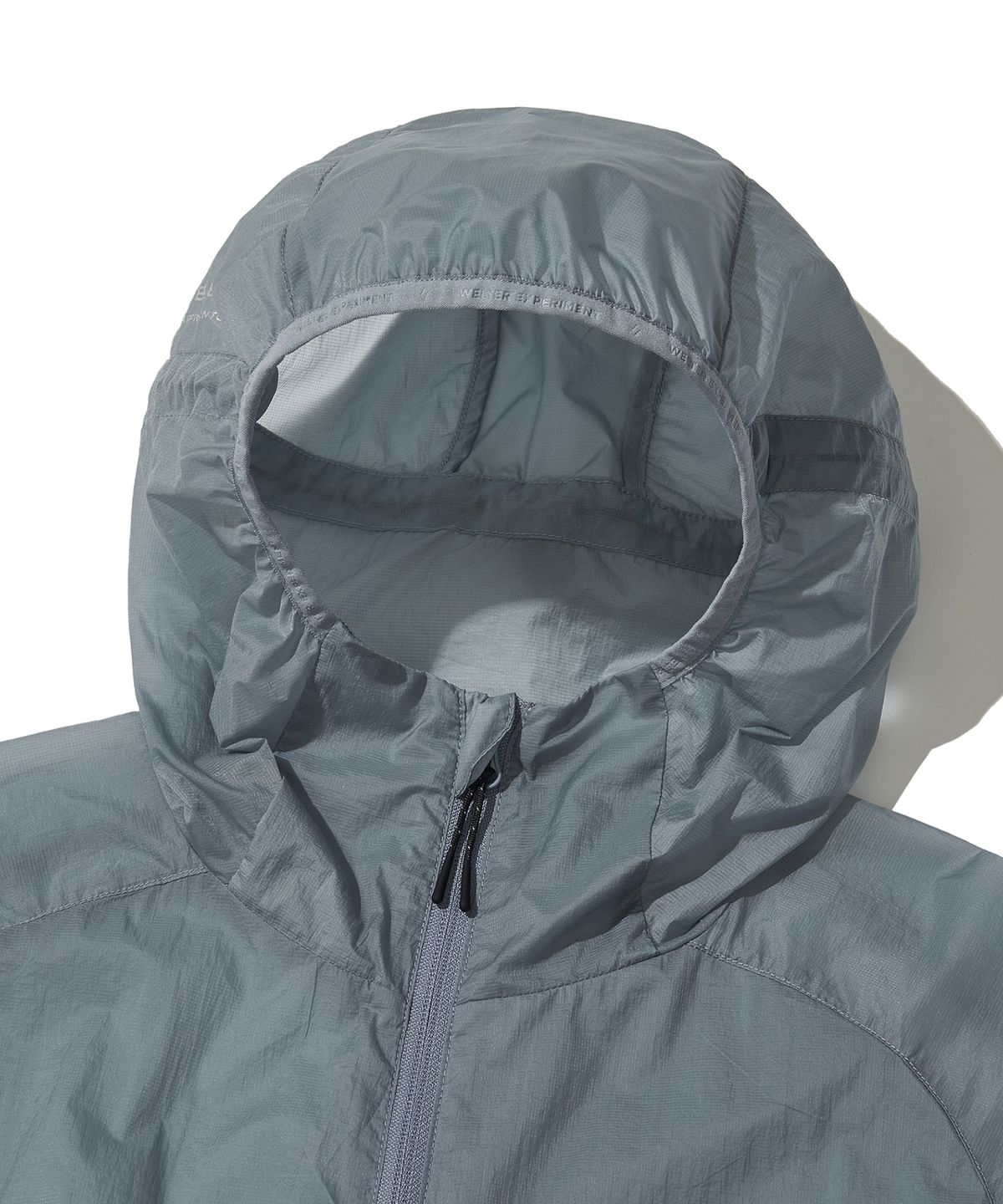 웰터 익스페리먼트(WELTER EXPERIMENT) NIMBUS AEROPACK WINDBREAKER_SKY BLUE