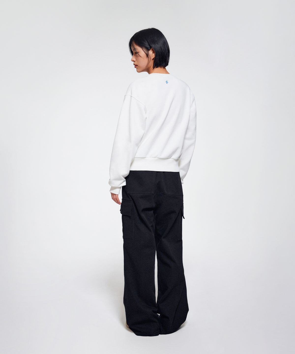 이알에이(ERA) WOMEN DIAGONAL CUT CARGO PANTS - BLACK