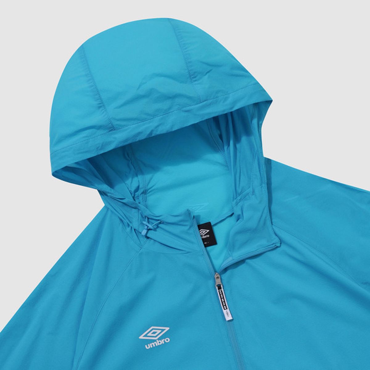 엄브로(UMBRO) [패커블] 셔틀런 초경량 후드형 바람막이 집업 자켓 블루(UQ221SJK51)