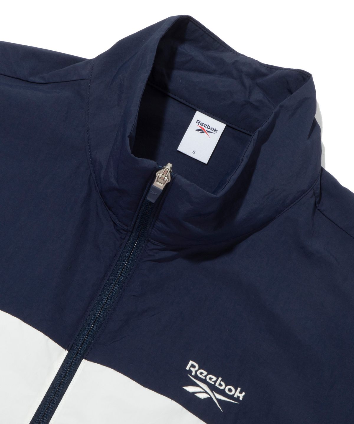 리복(REEBOK) DNA 크롭 윈드 브레이커 (W) - 네이비:레드