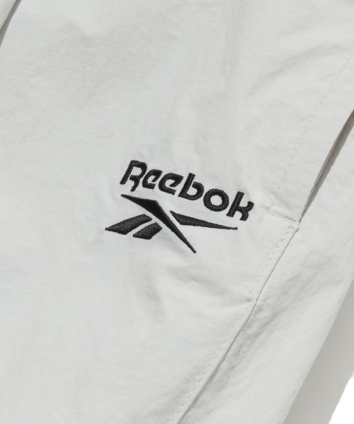 리복(REEBOK) 와이드 파라슈트 팬츠 - 라이트 그레이