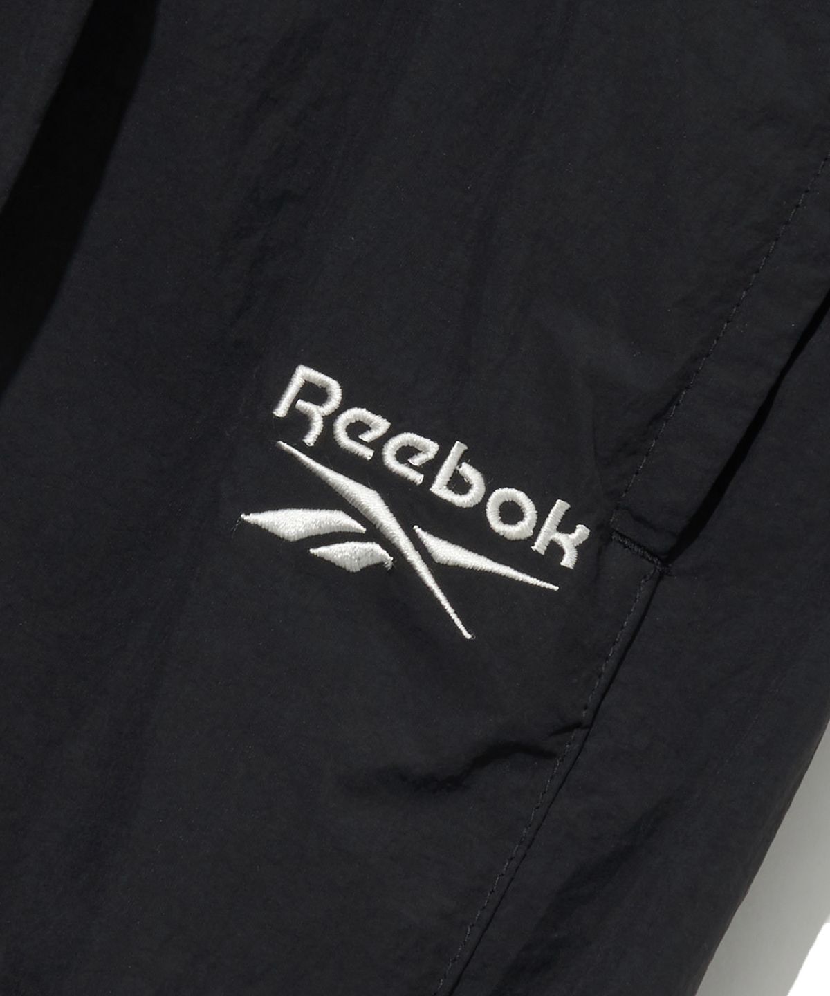 리복(REEBOK) 와이드 파라슈트 팬츠 - 블랙