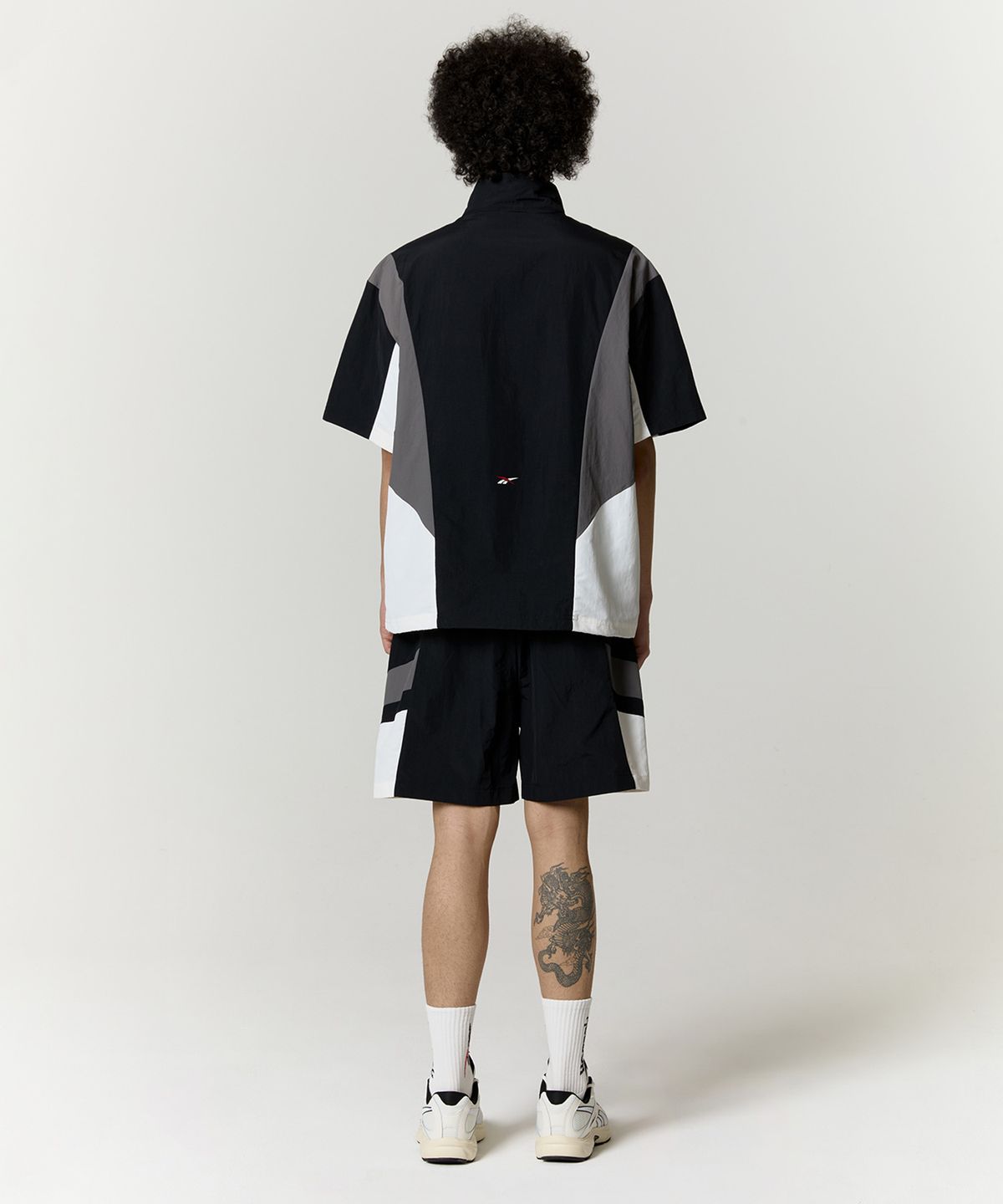 리복(REEBOK) DNA 반팔 아노락 - 블랙