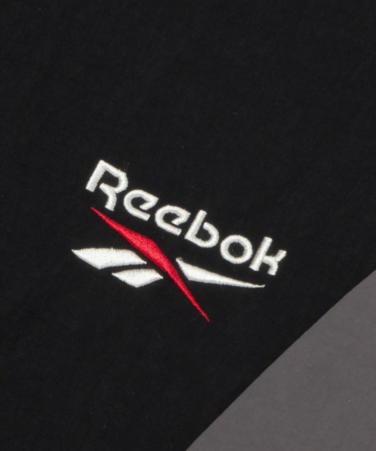 리복(REEBOK) DNA 반팔 아노락 - 블랙