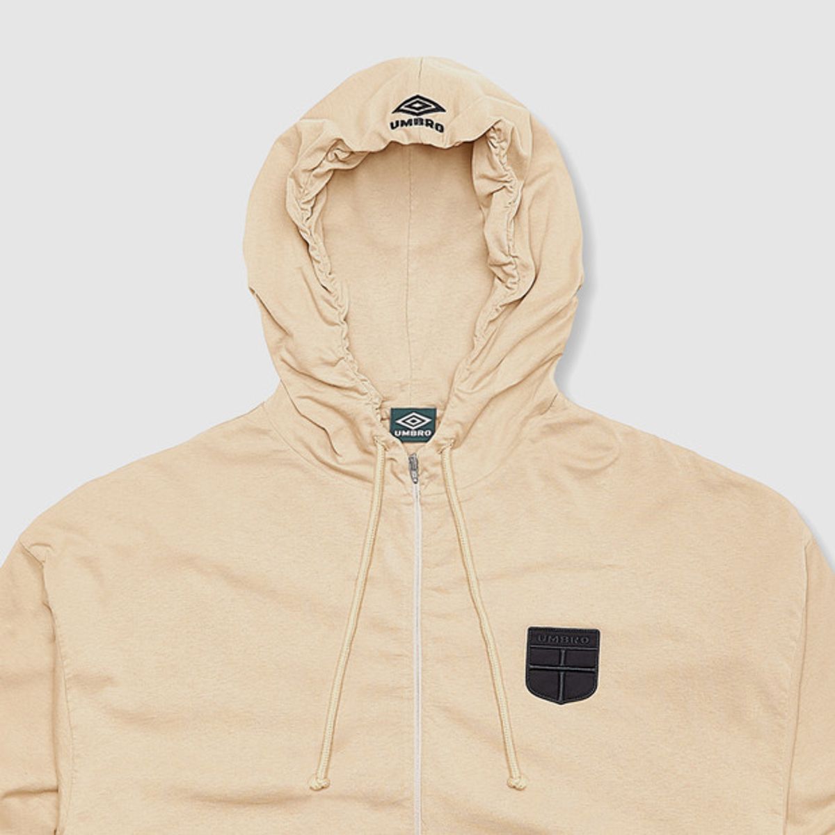 엄브로(UMBRO) [UMBRO X SLAM JAM] Crest Jersey 후드 자켓 아이보리(UQ111CFT38)