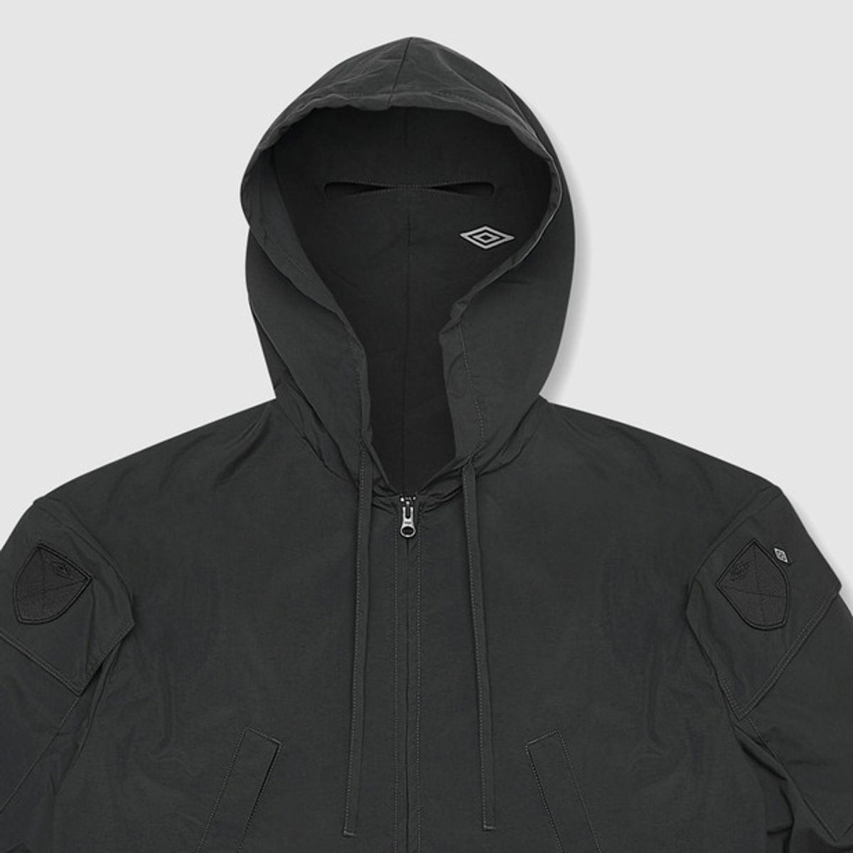 엄브로(UMBRO) [UMBRO X SLAM JAM] Tactical 긴팔 후드 자켓 블랙(UQ111CJK38)