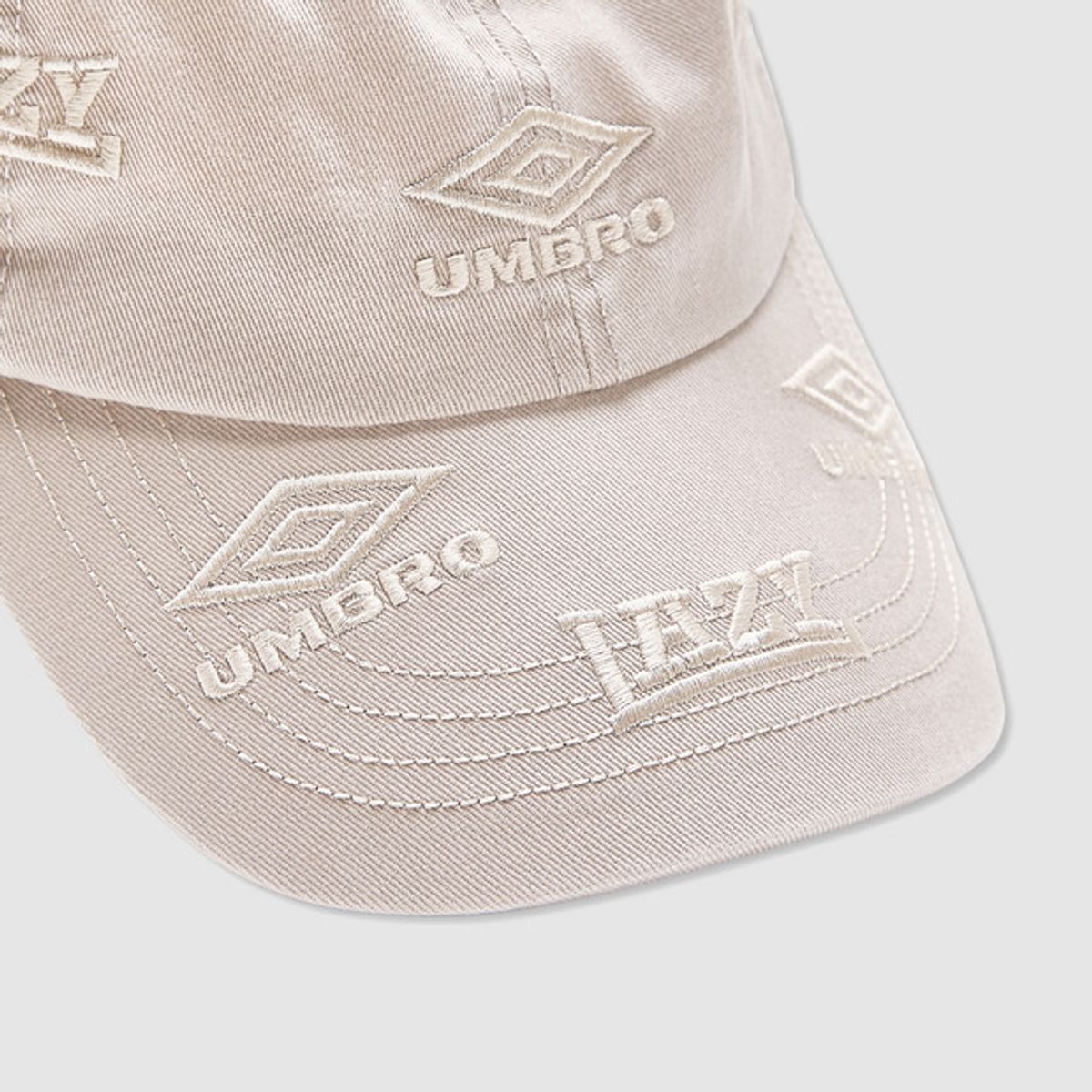 엄브로(UMBRO) [UMBRO X SLAM JAM] Lazy 볼캡 아이보리(UQ113CCP31)