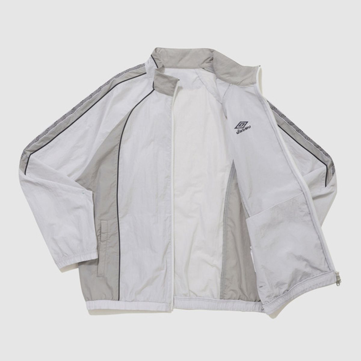엄브로(UMBRO) HBL BLOKE OG 트랙 우븐 바람막이 자켓 라이트 그레이(UQ221CJK52)