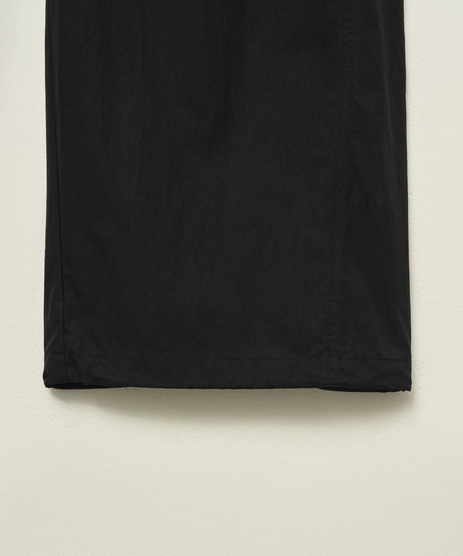 MUSINSA | SATUR Curved parachute pants black