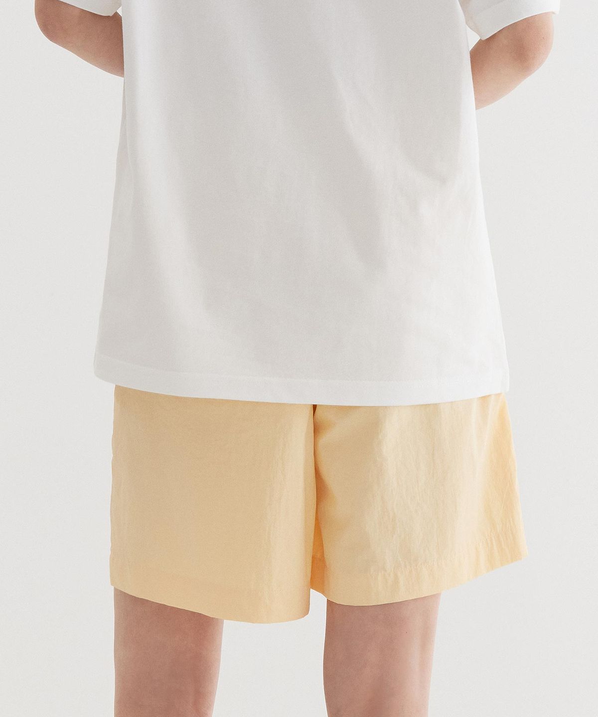 커버낫(COVERNAT) 레귤러 이지 나일론 쇼츠 Yellow