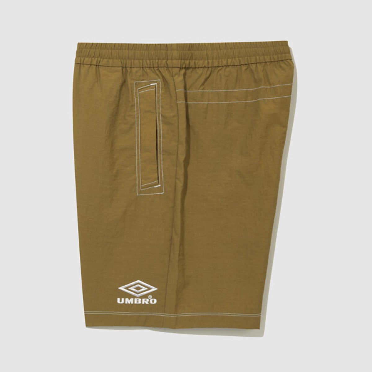 엄브로(UMBRO) 크리스피 타슬란 4.5부 반바지 카멜(UQ223CHP59)