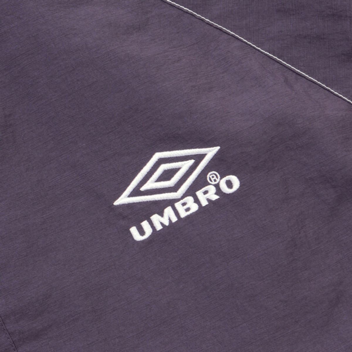 엄브로(UMBRO) 크리스피 타슬란 반팔 스탠넥 아노락 퍼플(UQ223CWT59)