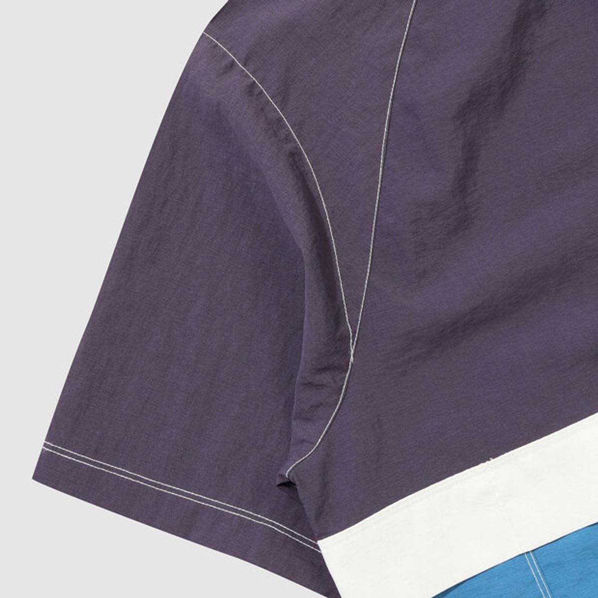 엄브로(UMBRO) 크리스피 타슬란 반팔 스탠넥 아노락 퍼플(UQ223CWT59)