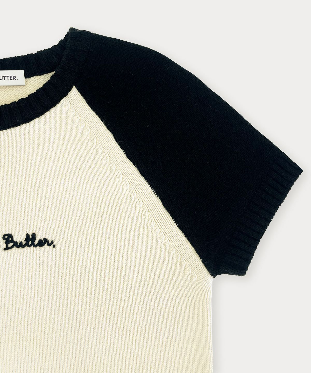 썸웨어버터(SOMEWHEREBUTTER) Casual Mini Letter Knit - Black