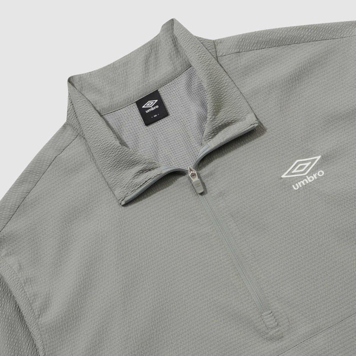 엄브로(UMBRO) 시어서커 반팔 스탠넥 아노락 카키(UQ221CWT63)