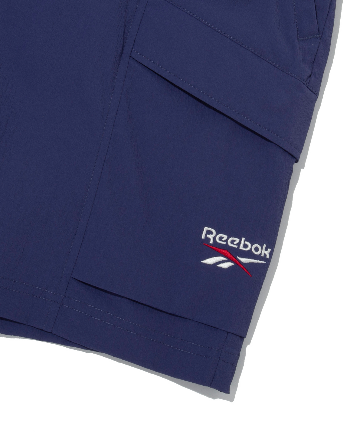 리복(REEBOK) 아이스 우븐 쇼츠 - 네이비