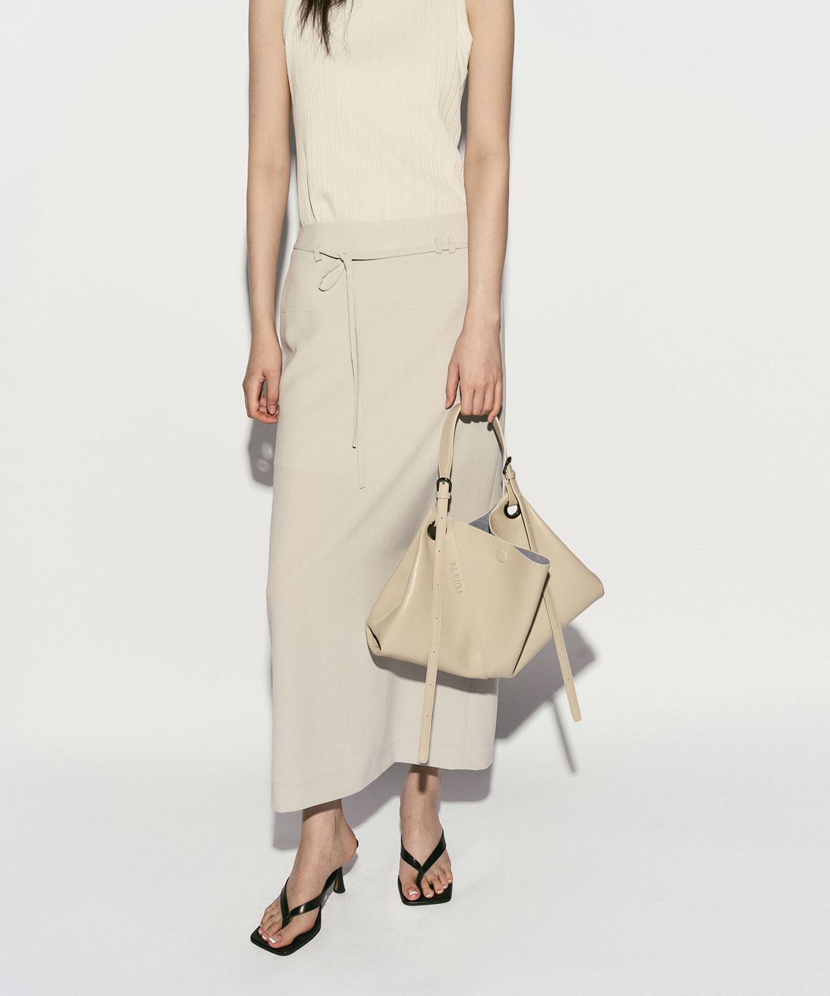 리이(RE RHEE) BELTED MIDI SKIRT DOVE GRAY
