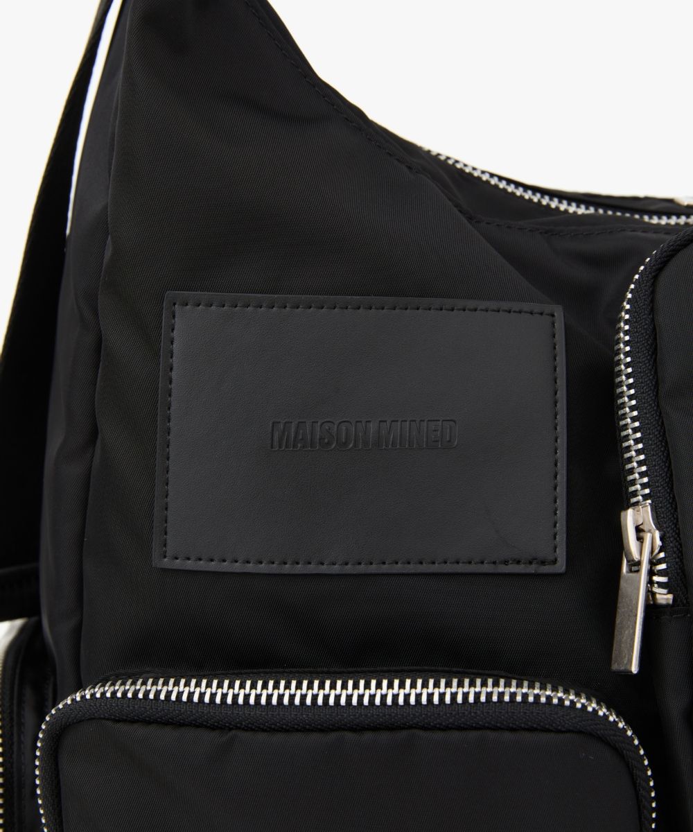 MUSINSA | MAISON MINED MULTI POCKET CROSS BAG