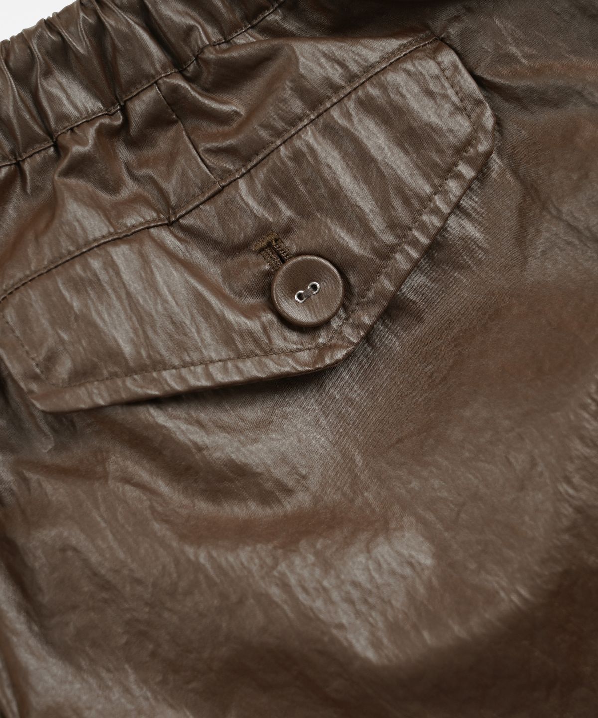 프리즘웍스(FRIZMWORKS) COATED CN SHORTS _ BROWN