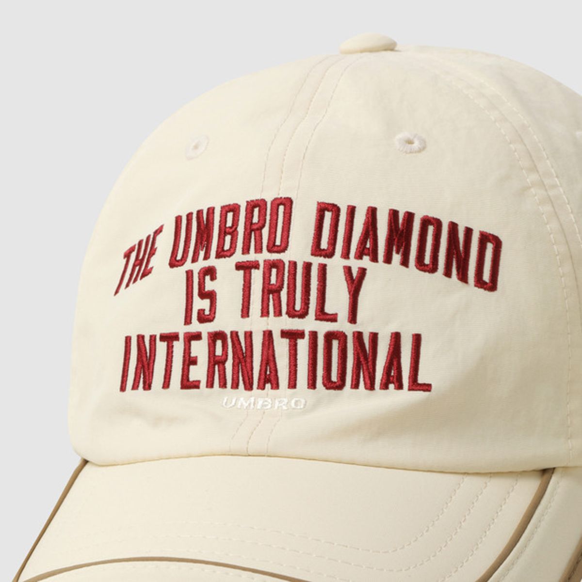 엄브로(UMBRO) 그래피티 링거 투톤캡 아이보리(UQ323CCP71)