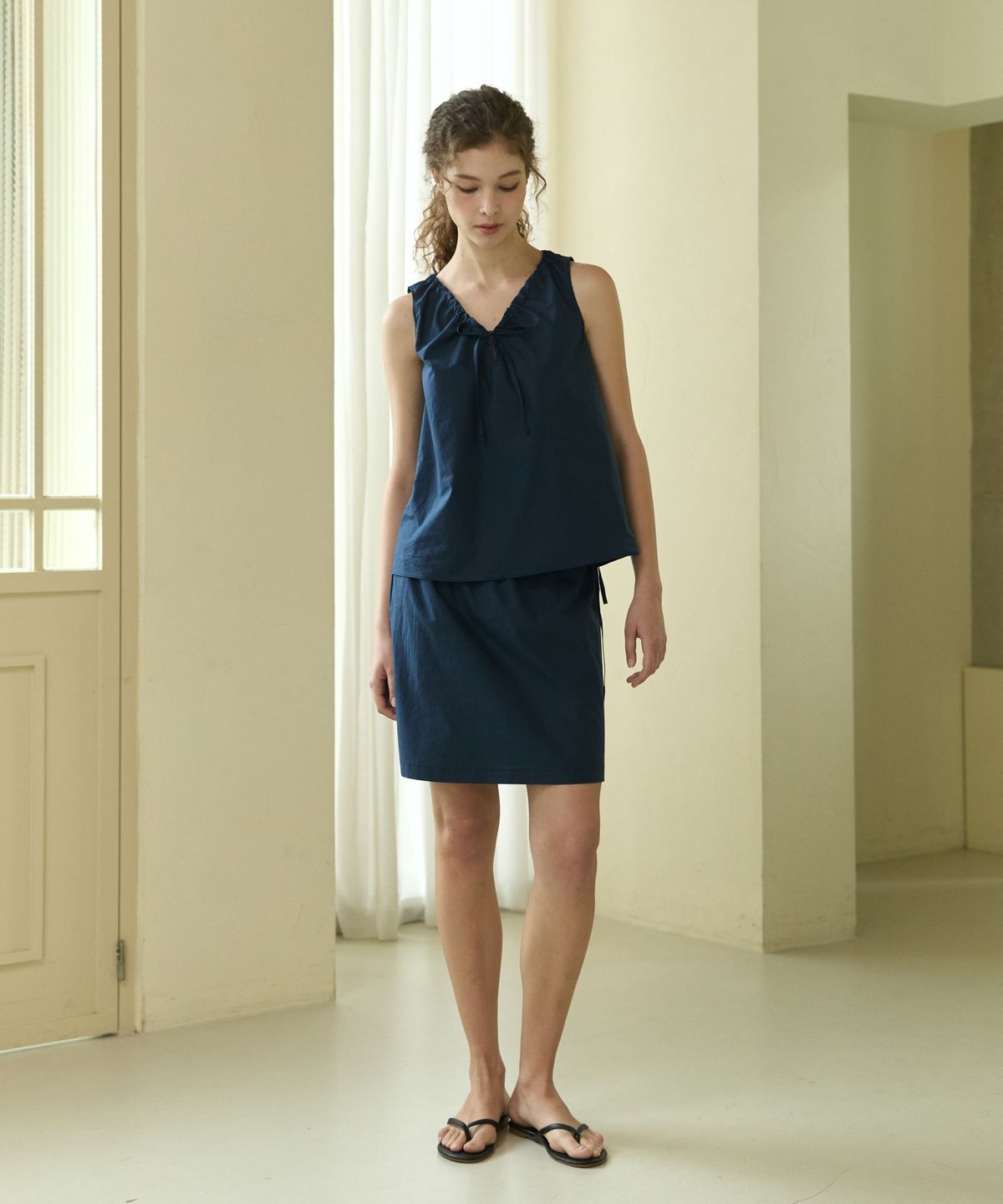 위오이(WIOE) Cotton Ribbon Midi Skirt_Navy