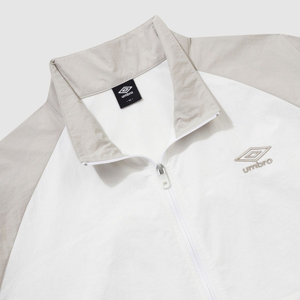 엄브로(UMBRO) 썬샤워 스탠넥 반팔 아노락 베이지(UQ321CWT71)