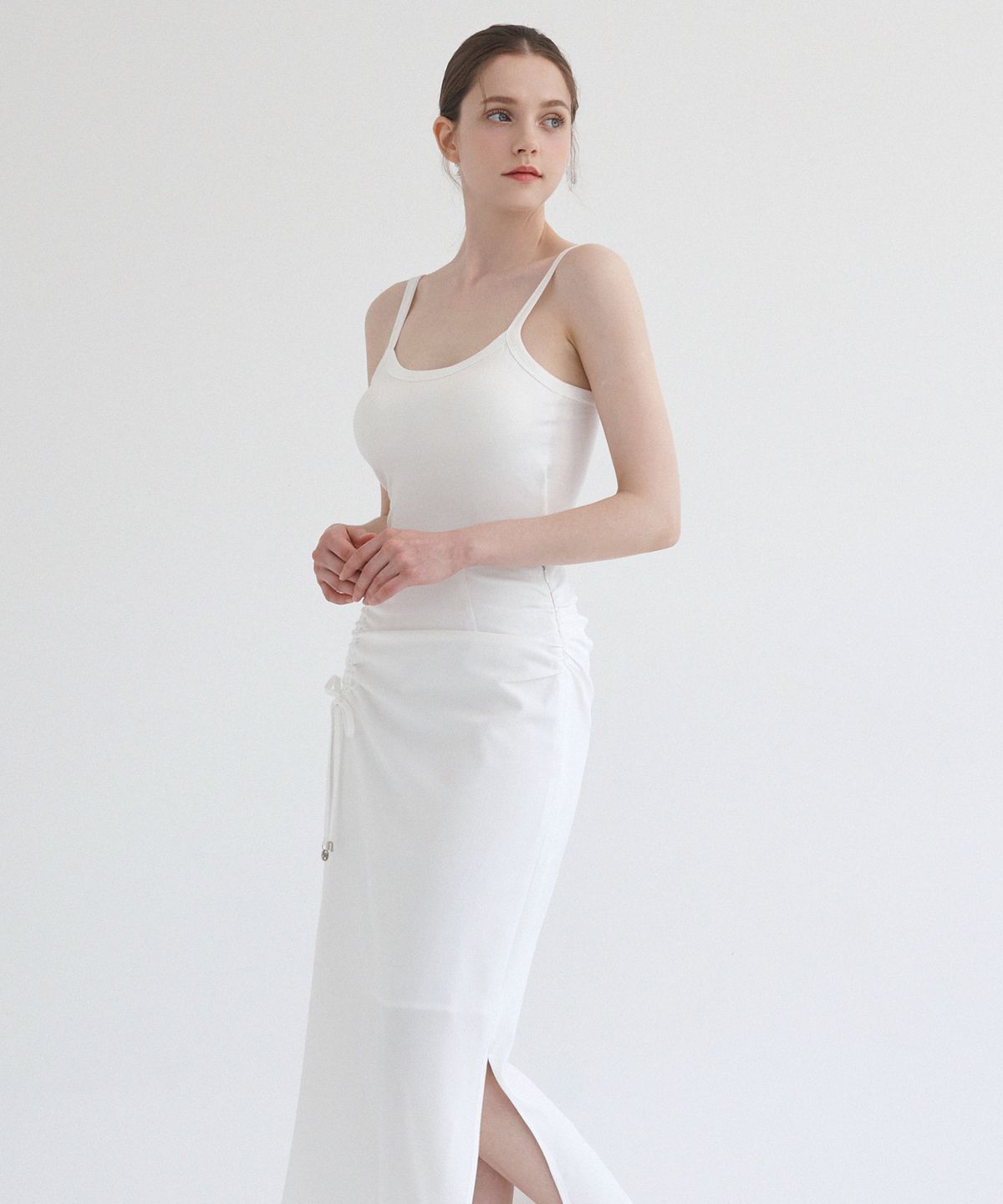 미케네(MICANE) 지젤 셔링 스트링 롱 스커트