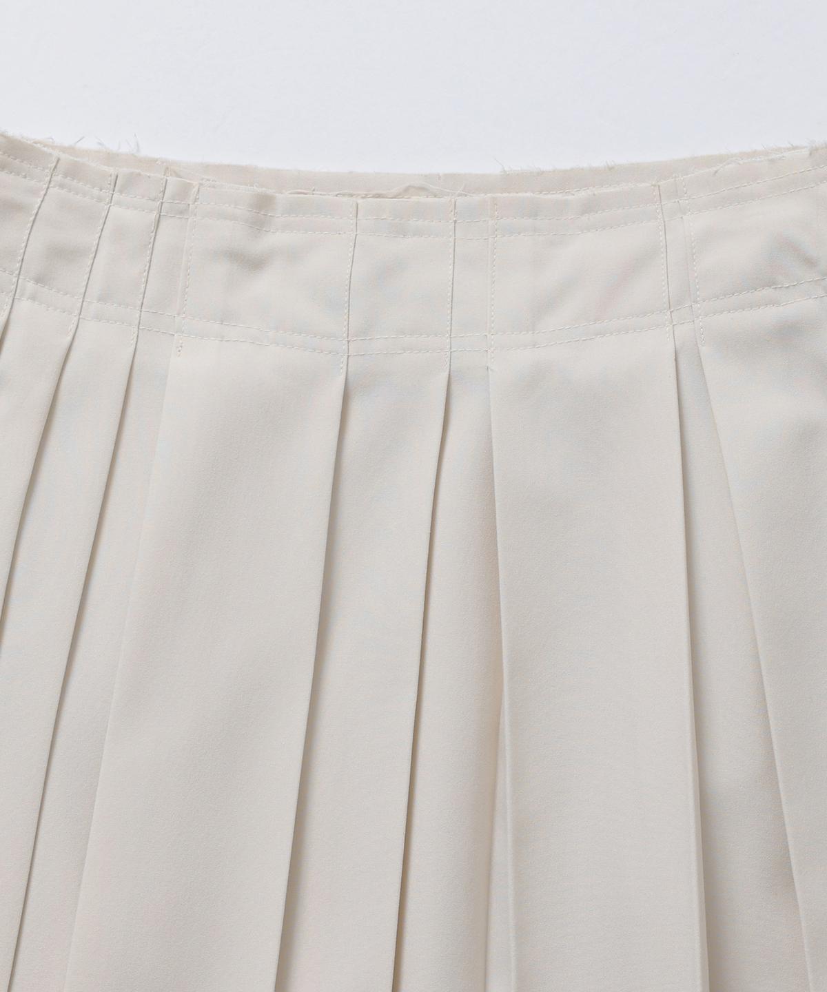 모슬루(MOSLU) Unbalanced pleats skirt (Ivory)