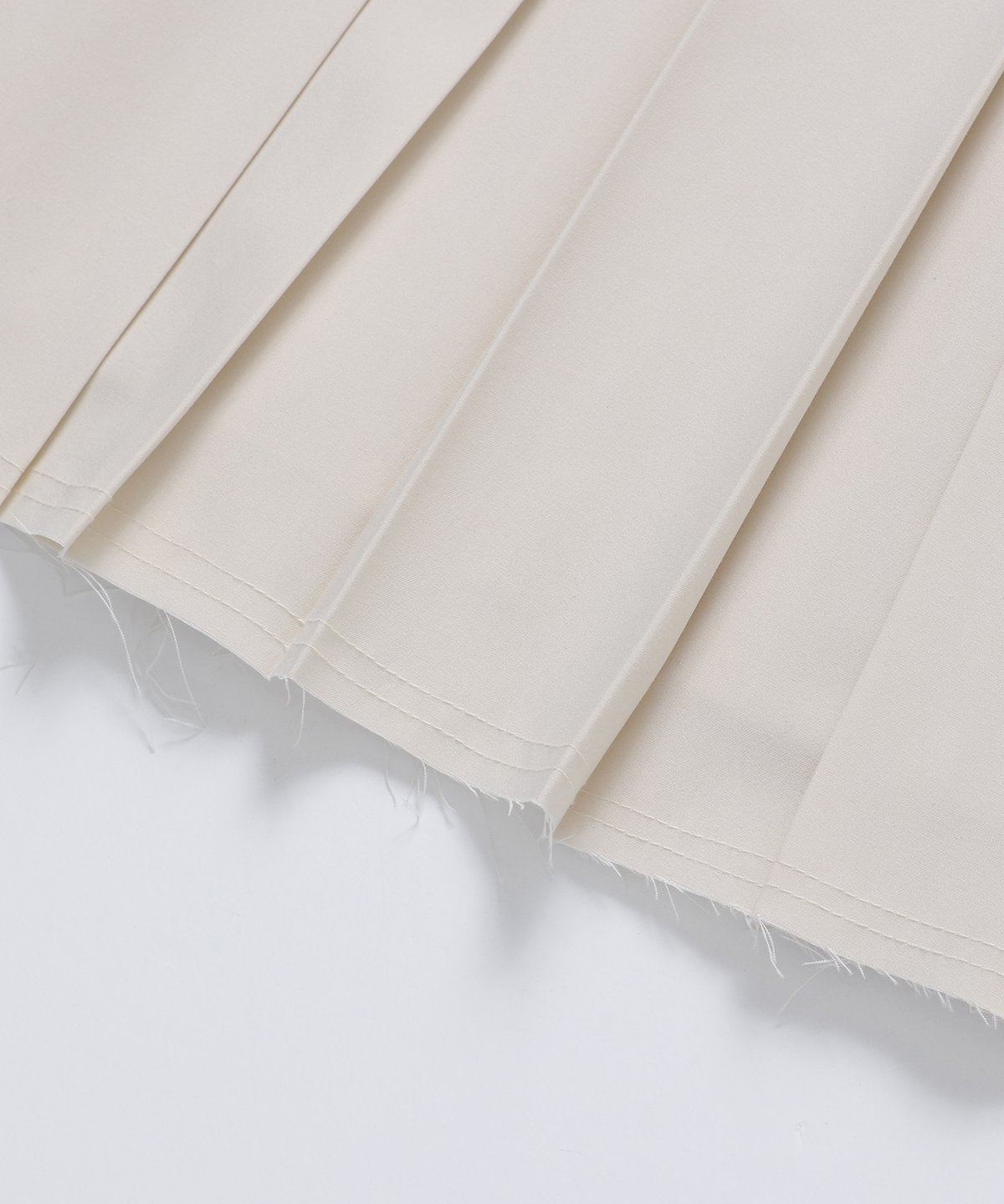 모슬루(MOSLU) Unbalanced pleats skirt (Ivory)