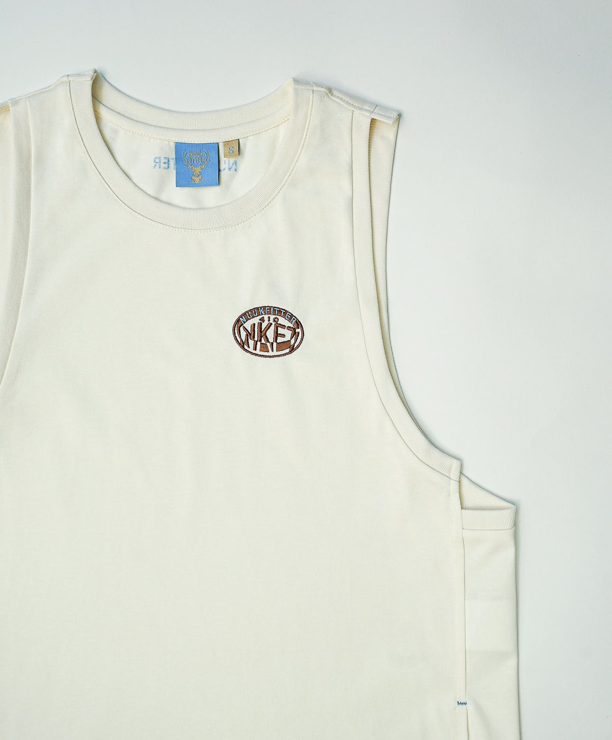 누크피터(NUUKFITTER) NKFT LAYERED SLIT SLEEVELESS_WOMEN [IVORY]