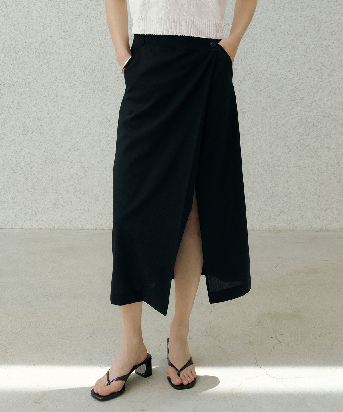 오떼뜨(OCTETTE) SUMMER-WOOL CLASSIC WRAP SKIRTS_BLACK