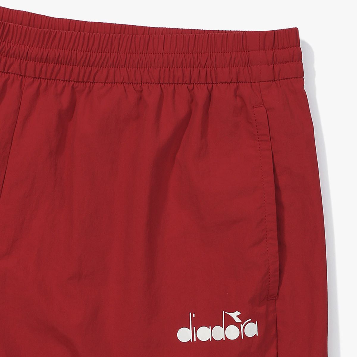 디아도라(diadora) 그랜드슬램 우븐 하프 팬츠 RED