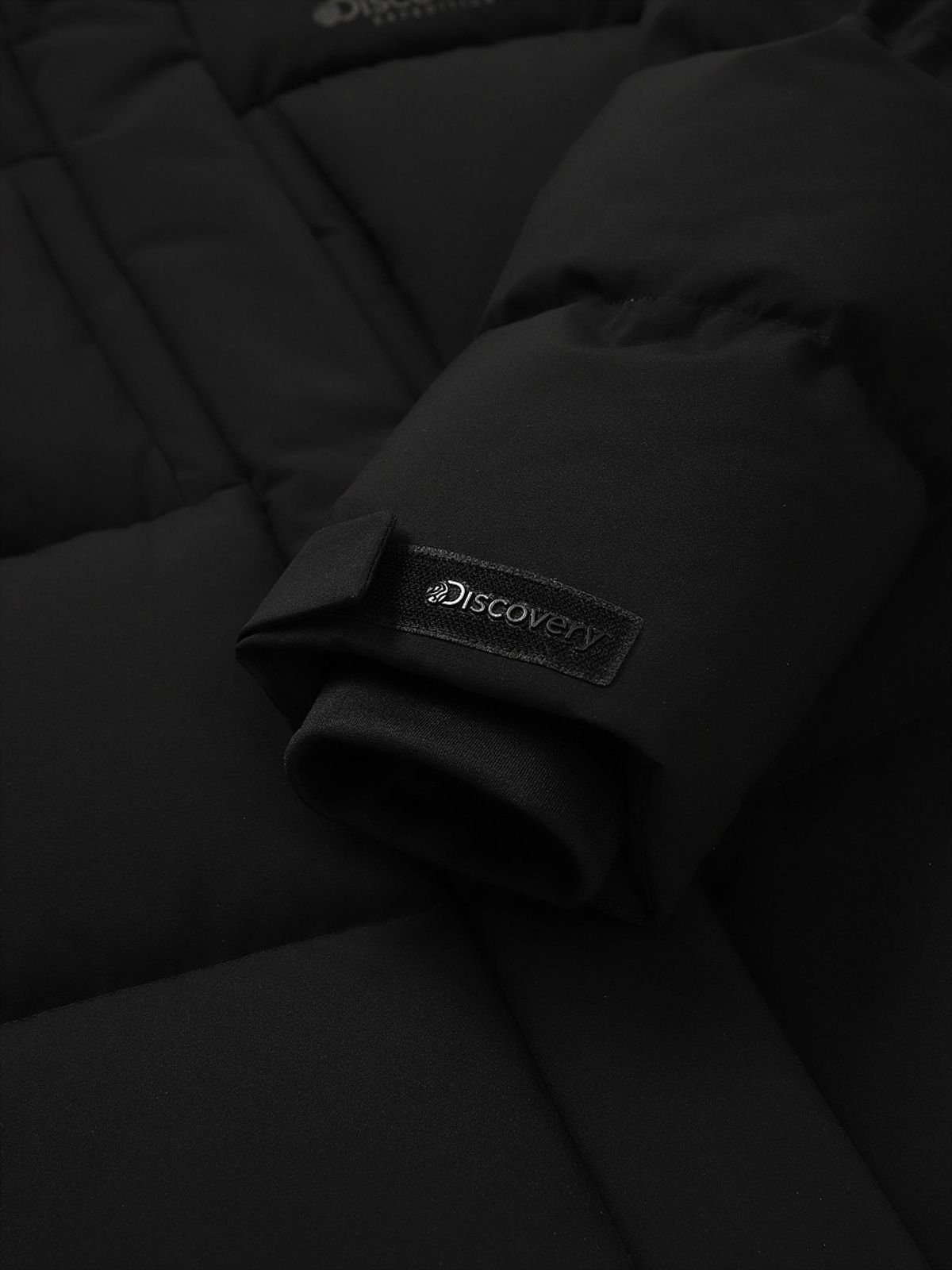 디스커버리 익스페디션(DISCOVERY EXPEDITION) 여성 레스터G 하이넥 구스다운 숏패딩 (BLACK)