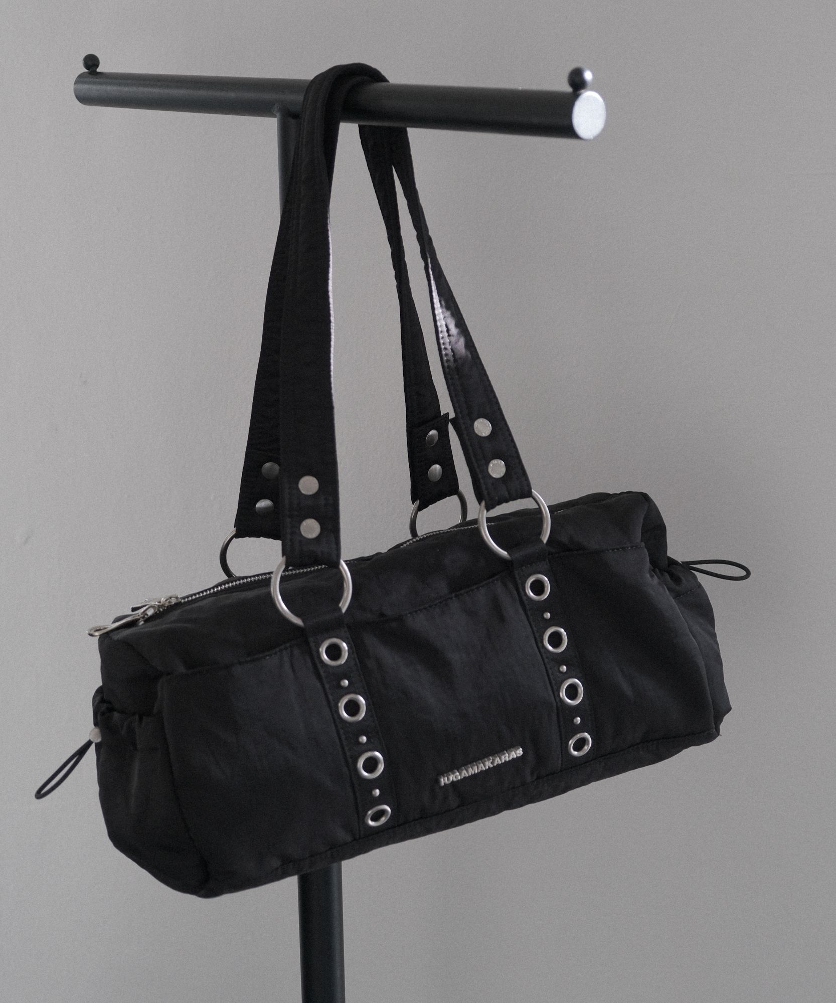MUSINSA | IUGAMAKARAS Nylon Eyelet Duffle Bag (Black)