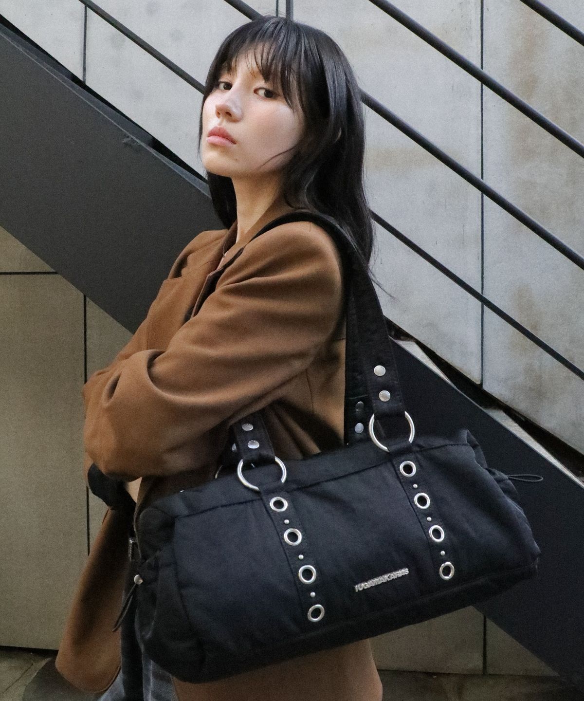 이우가마카라스(IUGAMAKARAS) Nylon Eyelet Duffle Bag (Black)