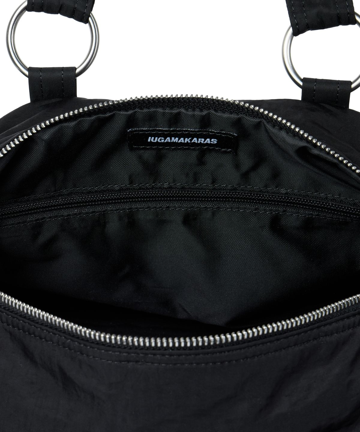 이우가마카라스(IUGAMAKARAS) Nylon Eyelet Duffle Bag (Black)