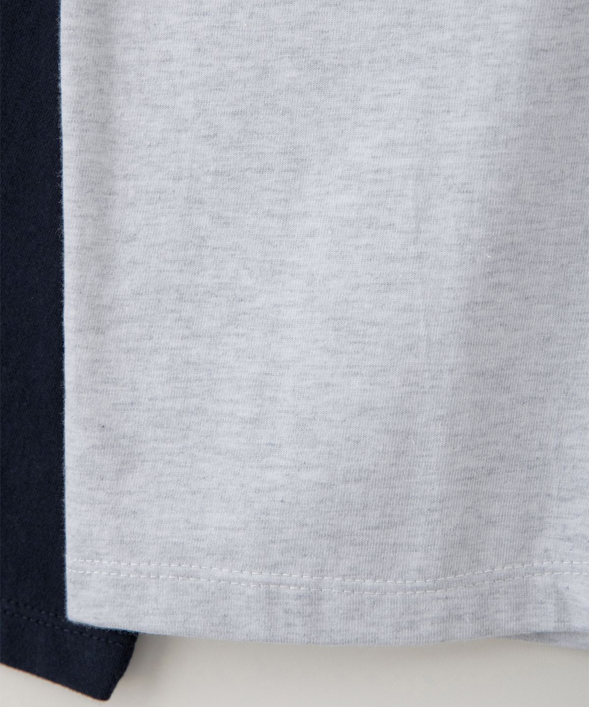 썸웨어버터(SOMEWHEREBUTTER) Wave Logo Raglan Long Top - White Melange(Navy)