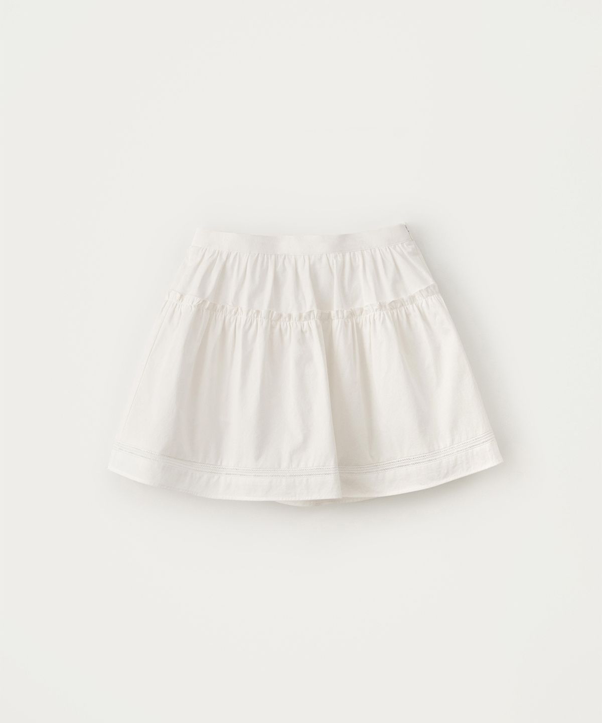 썸웨어버터(SOMEWHEREBUTTER) Soy Shirring Mini Skirt - Ivory