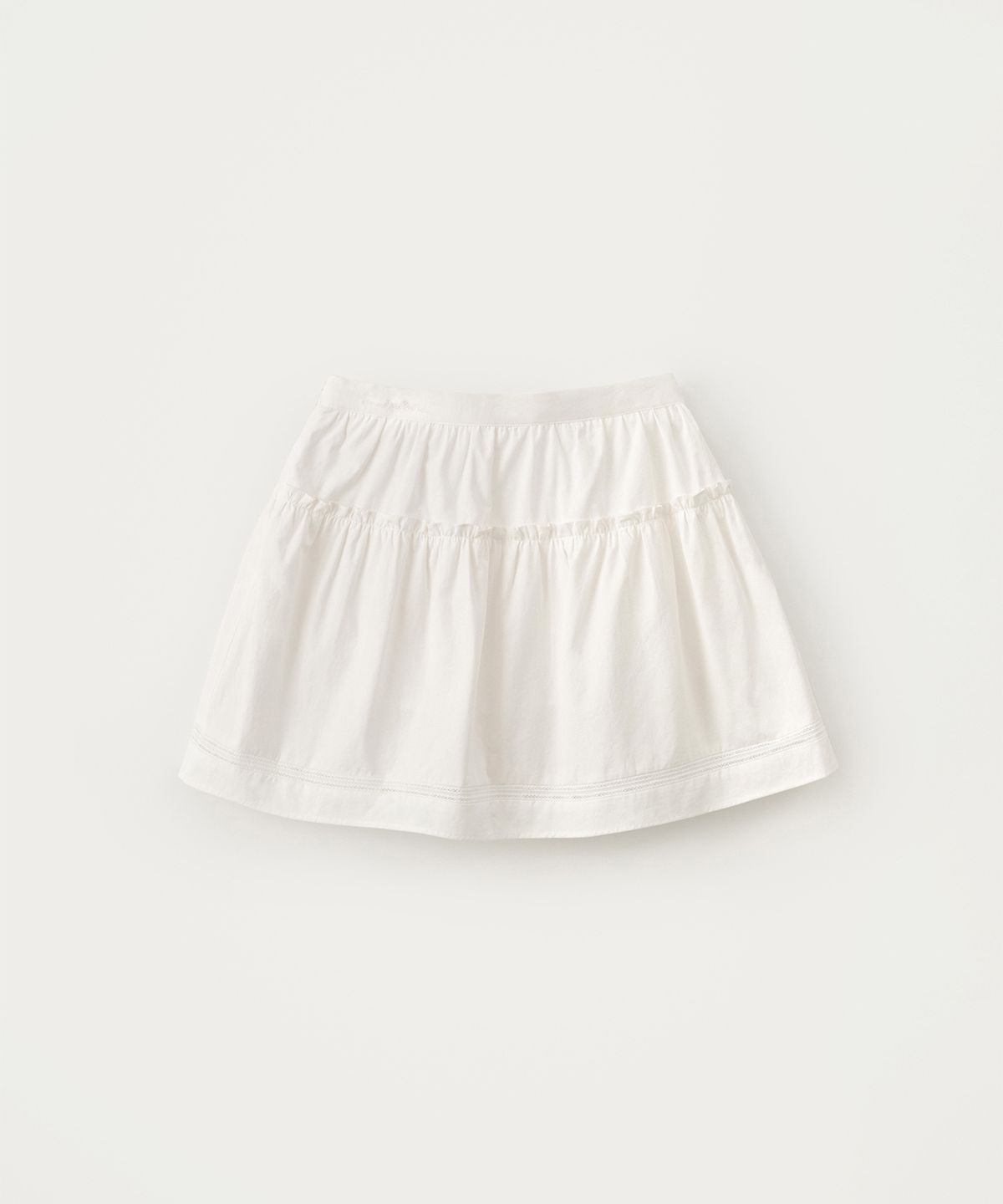 썸웨어버터(SOMEWHEREBUTTER) Soy Shirring Mini Skirt - Ivory