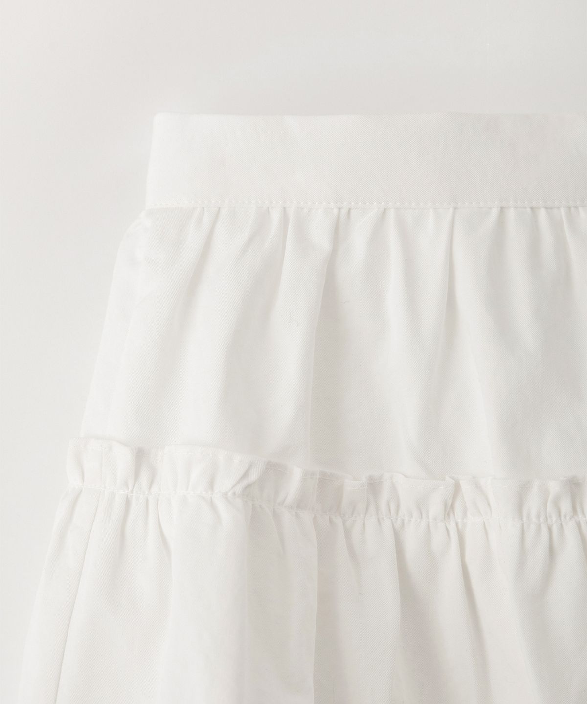 썸웨어버터(SOMEWHEREBUTTER) Soy Shirring Mini Skirt - Ivory