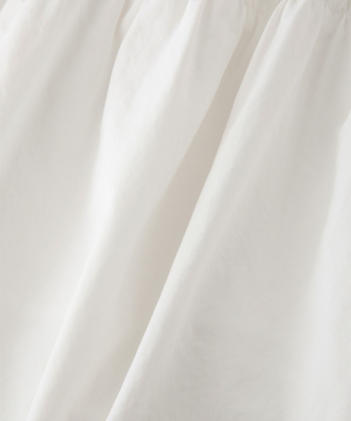 썸웨어버터(SOMEWHEREBUTTER) Soy Shirring Mini Skirt - Ivory