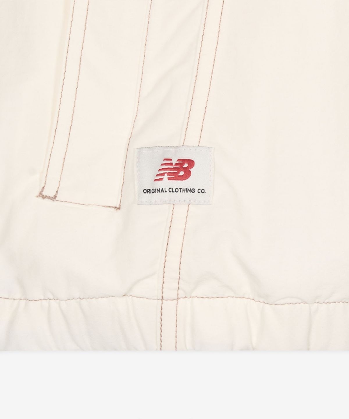 뉴발란스(NEW BALANCE) NBNAG2A303 / UNI ESCAPE 스탠넥 웜업자켓 (IVORY)